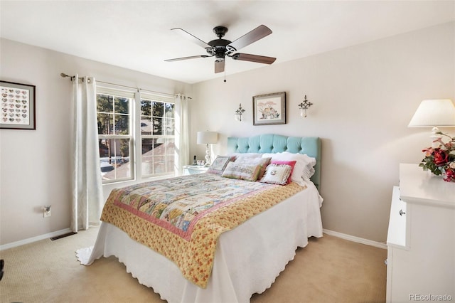 bedroom featuring visible vents, baseboards, and light carpet