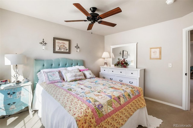 bedroom featuring baseboards, light carpet, and a ceiling fan