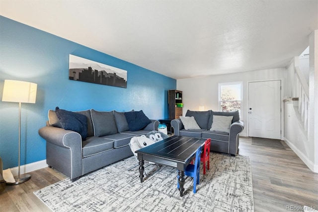 3660 S Ouray Cir, Aurora, CO 80013 - living area featuring wood finished floors and baseboards