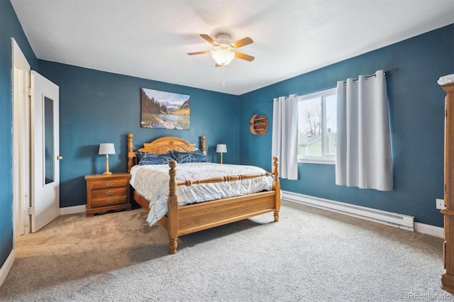 3660 S Ouray Cir, Aurora, CO 80013 - bedroom featuring a baseboard heating unit, carpet flooring, and a ceiling fan