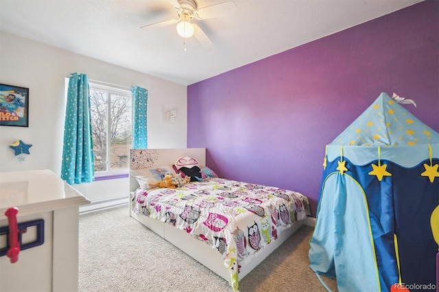 3660 S Ouray Cir, Aurora, CO 80013 - carpeted bedroom with a ceiling fan and a baseboard heating unit
