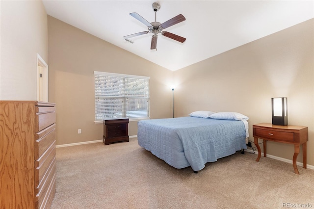 carpeted bedroom with vaulted ceiling and ceiling fan