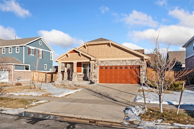 craftsman house featuring a garage and a porch