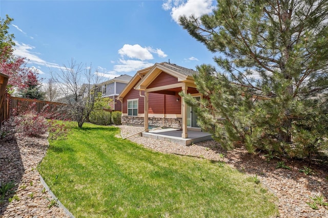 view of yard with fence and a patio area