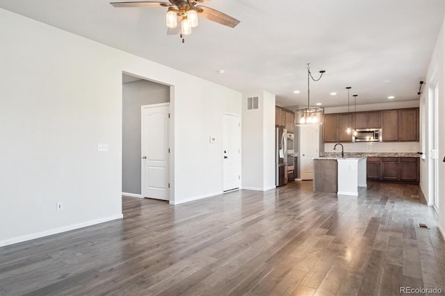 1457 Castle Creek Cir, Castle Rock, CO 80104 - unfurnished living room featuring dark wood-style floors, a ceiling fan, and recessed lighting