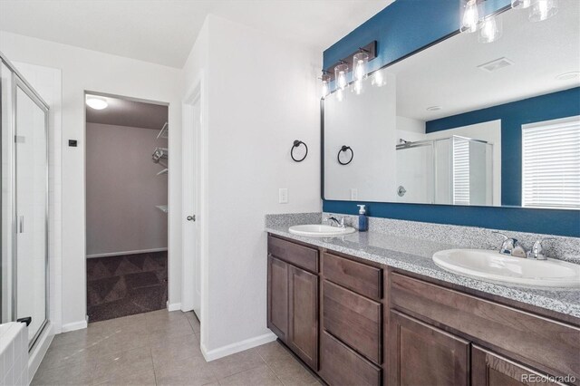 1457 Castle Creek Cir, Castle Rock, CO 80104 - bathroom with a shower stall, double vanity, and tile patterned flooring