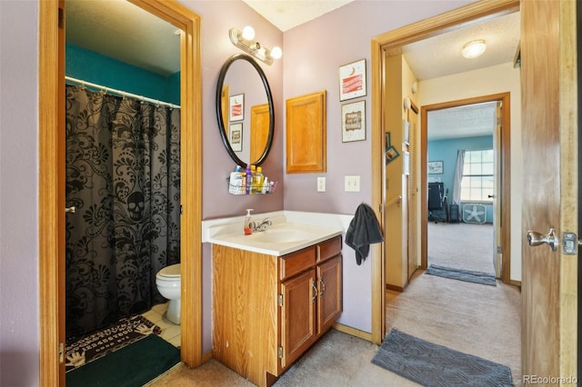 full bathroom featuring vanity, toilet, and baseboards