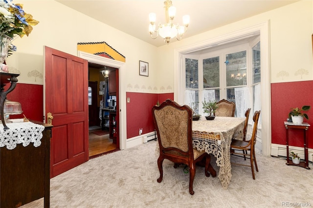 200 Rose St, Georgetown, CO 80444 - dining space with a chandelier, carpet floors, baseboard heating, and a baseboard radiator