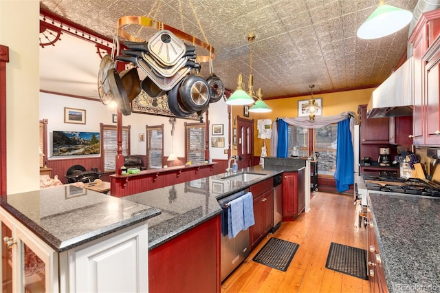 200 Rose St, Georgetown, CO 80444 - kitchen with dishwasher, light wood-style floors, an ornate ceiling, ornamental molding, and an island with sink