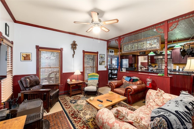 200 Rose St, Georgetown, CO 80444 - living room with a wainscoted wall, ceiling fan, and ornamental molding
