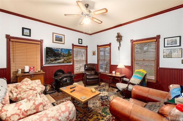 200 Rose St, Georgetown, CO 80444 - living room featuring wainscoting, ceiling fan, crown molding, and wood walls