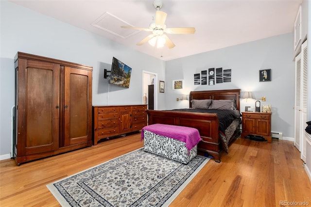 200 Rose St, Georgetown, CO 80444 - bedroom featuring a baseboard heating unit, light wood-type flooring, and a ceiling fan