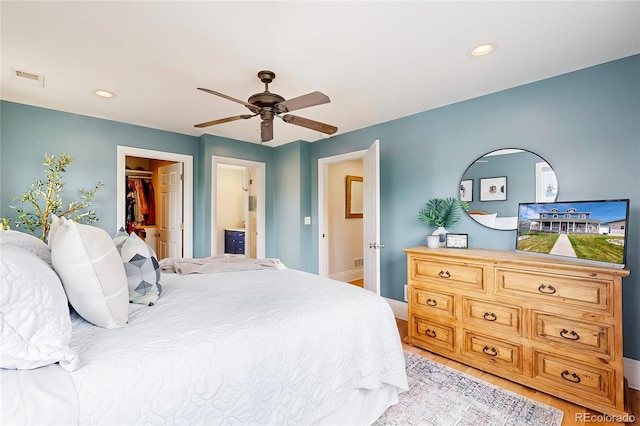 2221 Illinois St, Golden, CO 80401 - bedroom with a spacious closet, light wood-style floors, a ceiling fan, recessed lighting, and a closet