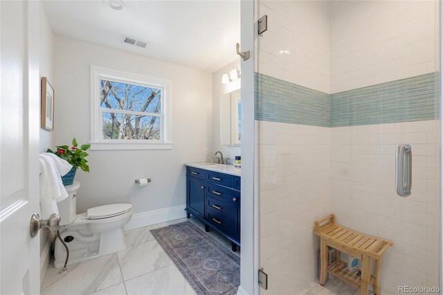 2221 Illinois St, Golden, CO 80401 - full bath featuring vanity, marble finish flooring, and a shower