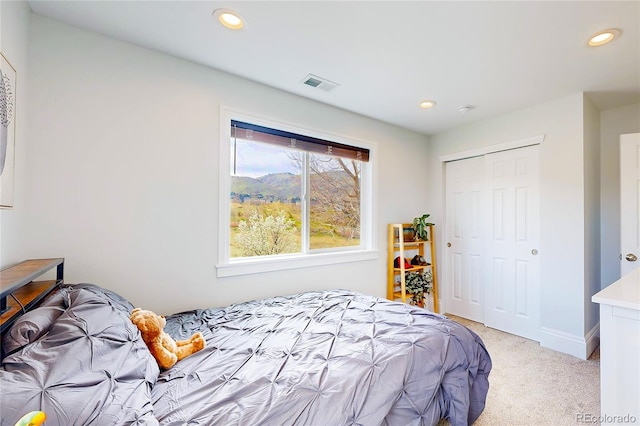 2221 Illinois St, Golden, CO 80401 - bedroom with light carpet, recessed lighting, and a closet