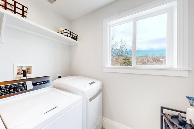2221 Illinois St, Golden, CO 80401 - washroom with washing machine and clothes dryer and healthy amount of natural light