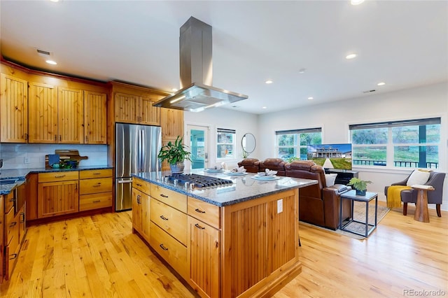 2221 Illinois St, Golden, CO 80401 - kitchen featuring stainless steel appliances, island range hood, light wood-type flooring, dark stone counters, and recessed lighting