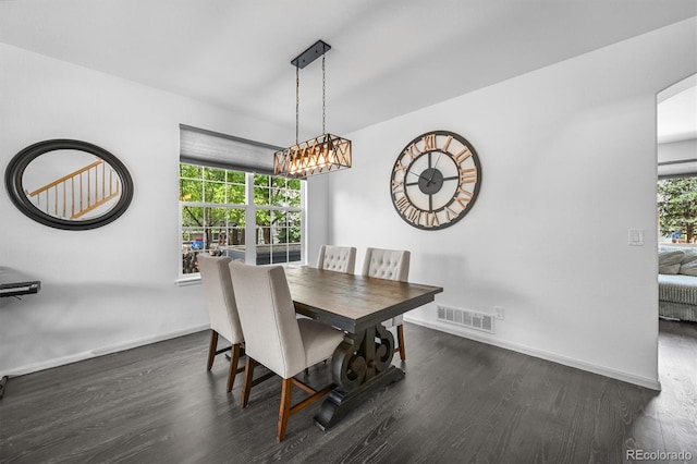 17395 E Dewberry Dr, Parker, CO 80134 - dining area with dark wood-type flooring and baseboards