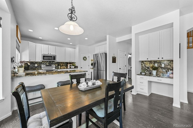 17395 E Dewberry Dr, Parker, CO 80134 - dining room featuring dark wood-style flooring, baseboards, and recessed lighting