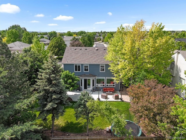 17395 E Dewberry Dr, Parker, CO 80134 - back of property with an outdoor hangout area, a patio area, and a shingled roof