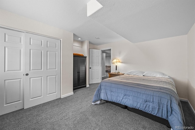 17395 E Dewberry Dr, Parker, CO 80134 - carpeted bedroom featuring a textured ceiling, baseboards, and a closet