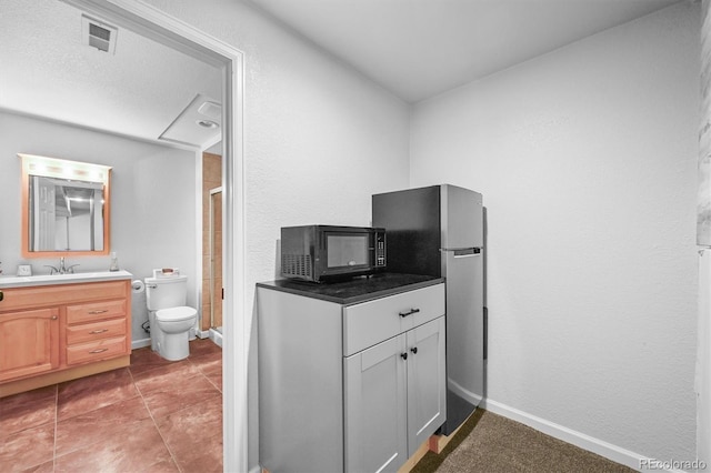 17395 E Dewberry Dr, Parker, CO 80134 - bathroom featuring vanity, a stall shower, toilet, and baseboards