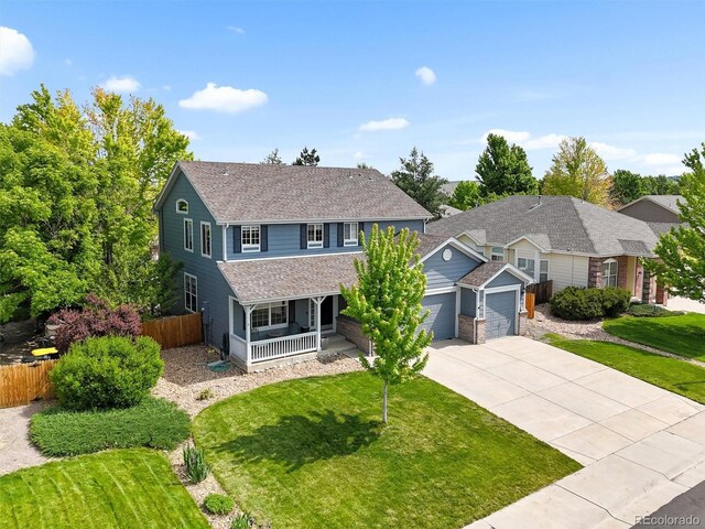 17395 E Dewberry Dr, Parker, CO 80134 - view of front facade with a porch, concrete driveway, a garage, and roof with shingles