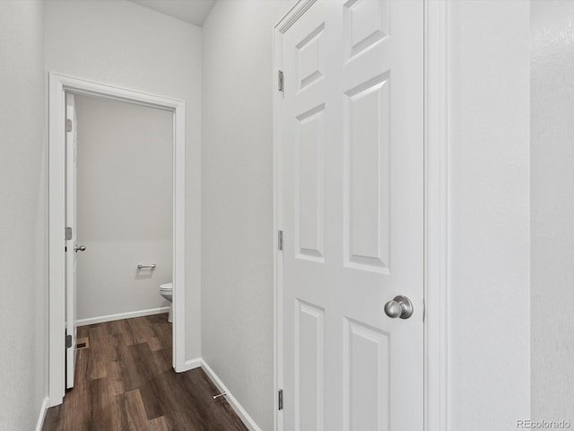 1023 Odessa Lake Rd, Severance, CO 80550 - hall featuring dark wood-type flooring and baseboards