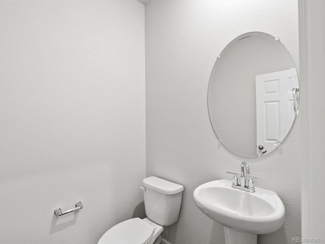 1023 Odessa Lake Rd, Severance, CO 80550 - half bathroom with a sink and toilet