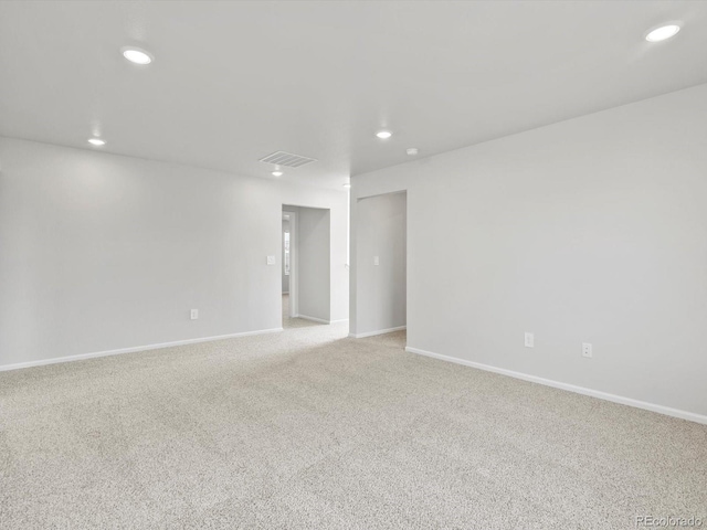 1023 Odessa Lake Rd, Severance, CO 80550 - spare room with light colored carpet and recessed lighting