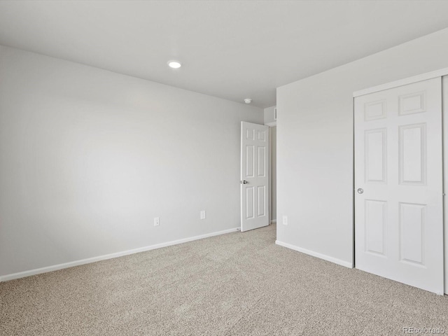 1023 Odessa Lake Rd, Severance, CO 80550 - unfurnished bedroom featuring light carpet and recessed lighting