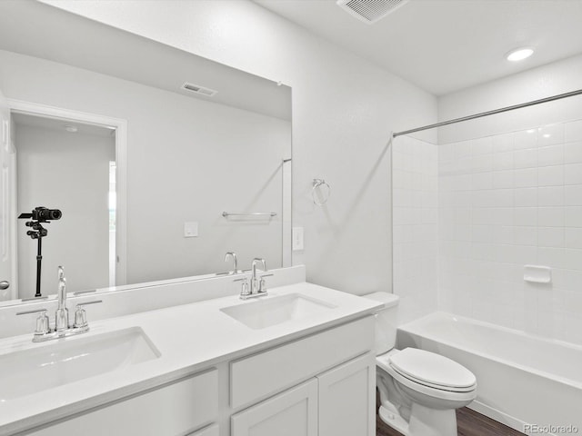 1023 Odessa Lake Rd, Severance, CO 80550 - bathroom with double vanity, bathing tub / shower combination, and wood finished floors