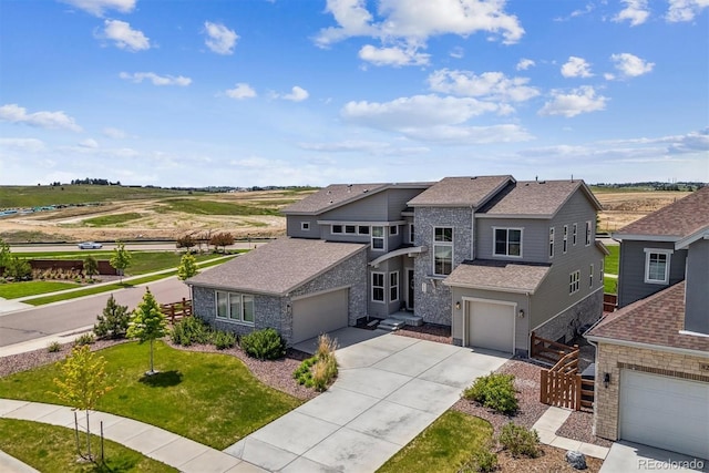 8299 S Kellerman, Aurora, CO 80016 - view of front facade with concrete driveway, stone siding, a shingled roof, and a front lawn