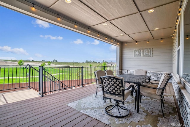 8299 S Kellerman, Aurora, CO 80016 - deck featuring a view of countryside and outdoor dining space