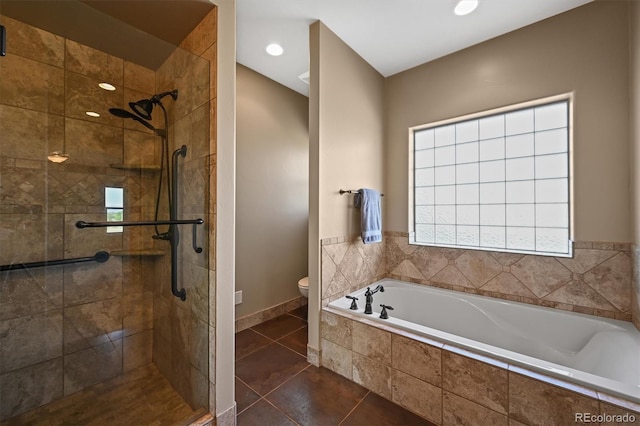 1743 Homestead Dr, Fort Lupton, CO 80621 - full bath featuring a stall shower, toilet, a garden tub, tile patterned flooring, and baseboards