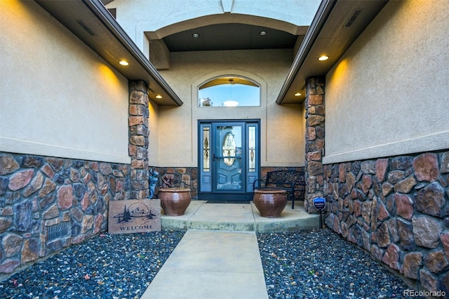 1743 Homestead Dr, Fort Lupton, CO 80621 - property entrance featuring stone siding and stucco siding