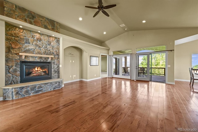 1743 Homestead Dr, Fort Lupton, CO 80621 - unfurnished living room featuring ceiling fan, a fireplace, wood finished floors, high vaulted ceiling, and baseboards
