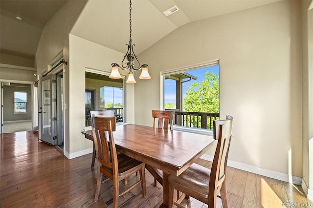 1743 Homestead Dr, Fort Lupton, CO 80621 - dining space with lofted ceiling, plenty of natural light, dark wood-type flooring, and baseboards