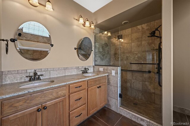 1743 Homestead Dr, Fort Lupton, CO 80621 - full bath with a stall shower, double vanity, and tile patterned floors