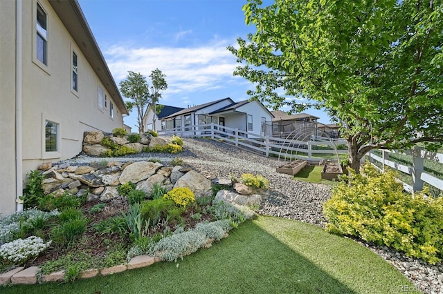 1743 Homestead Dr, Fort Lupton, CO 80621 - view of yard featuring a garden and fence