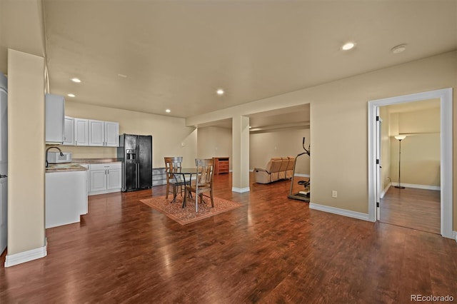 1743 Homestead Dr, Fort Lupton, CO 80621 - dining area with dark wood finished floors, recessed lighting, and baseboards