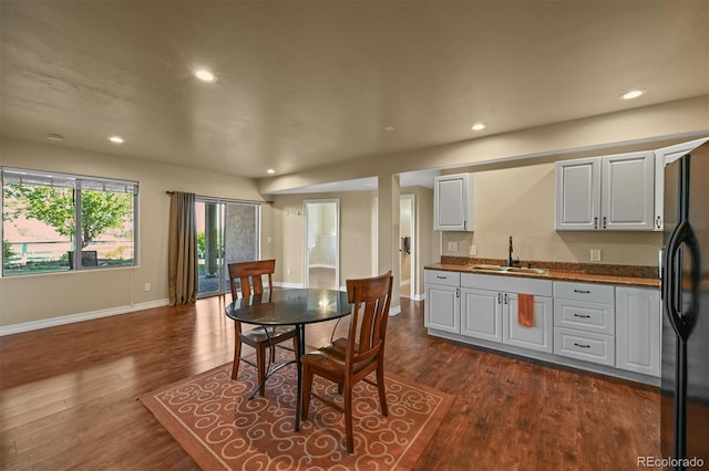 1743 Homestead Dr, Fort Lupton, CO 80621 - dining area featuring dark wood-type flooring, recessed lighting, and baseboards