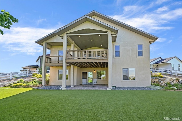 1743 Homestead Dr, Fort Lupton, CO 80621 - rear view of house featuring stucco siding and a patio area
