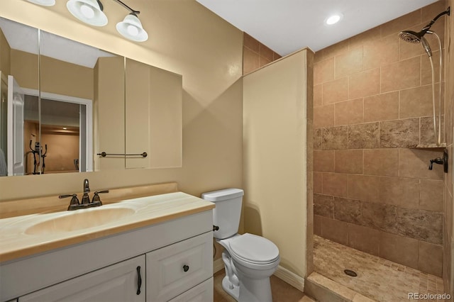 1743 Homestead Dr, Fort Lupton, CO 80621 - bathroom with toilet, a tile shower, vanity, and recessed lighting