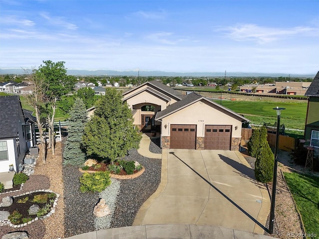 1743 Homestead Dr, Fort Lupton, CO 80621 - single story home featuring stucco siding, stone siding, driveway, an attached garage, and fence
