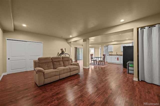 1743 Homestead Dr, Fort Lupton, CO 80621 - living room featuring dark wood-style floors, recessed lighting, and baseboards