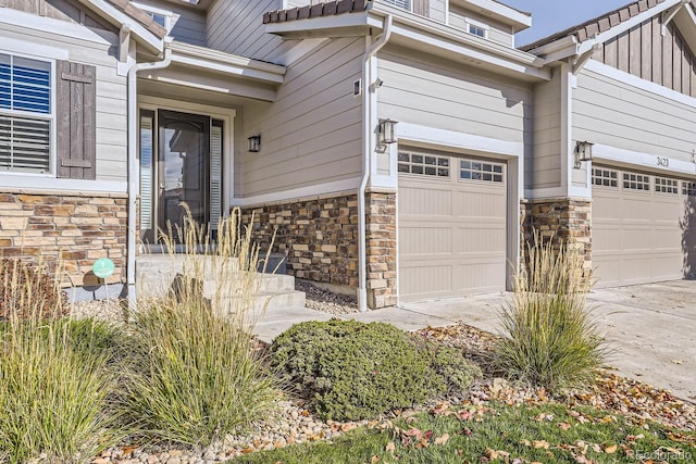 view of exterior entry with a garage