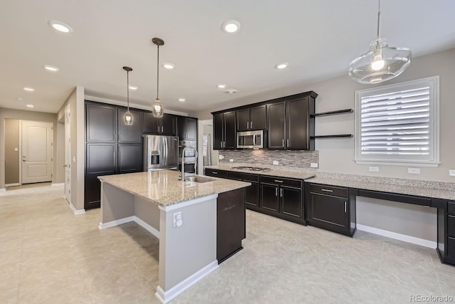 3423 Princeton Pl, Broomfield, CO 80023 - kitchen featuring appliances with stainless steel finishes, a sink, light stone counters, backsplash, and pendant lighting