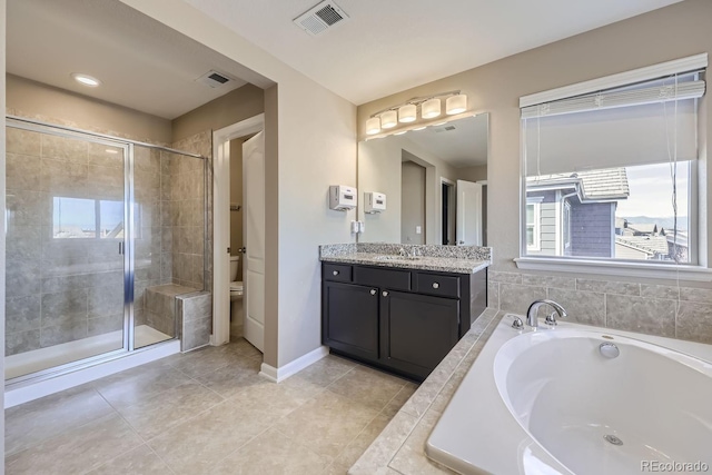 full bathroom with vanity, tile patterned floors, plus walk in shower, and toilet