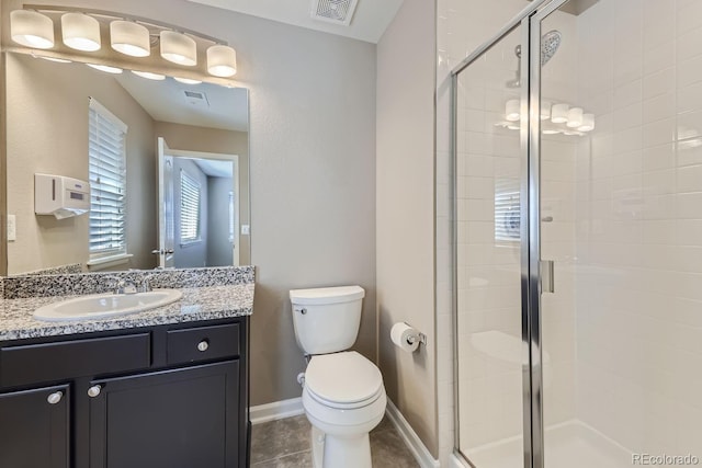 bathroom with vanity, an enclosed shower, tile patterned floors, and toilet